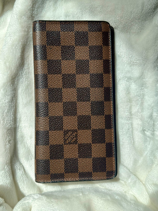 Louis Vuitton vertical bi-fold long wallet in Damier Ebene coated canvas