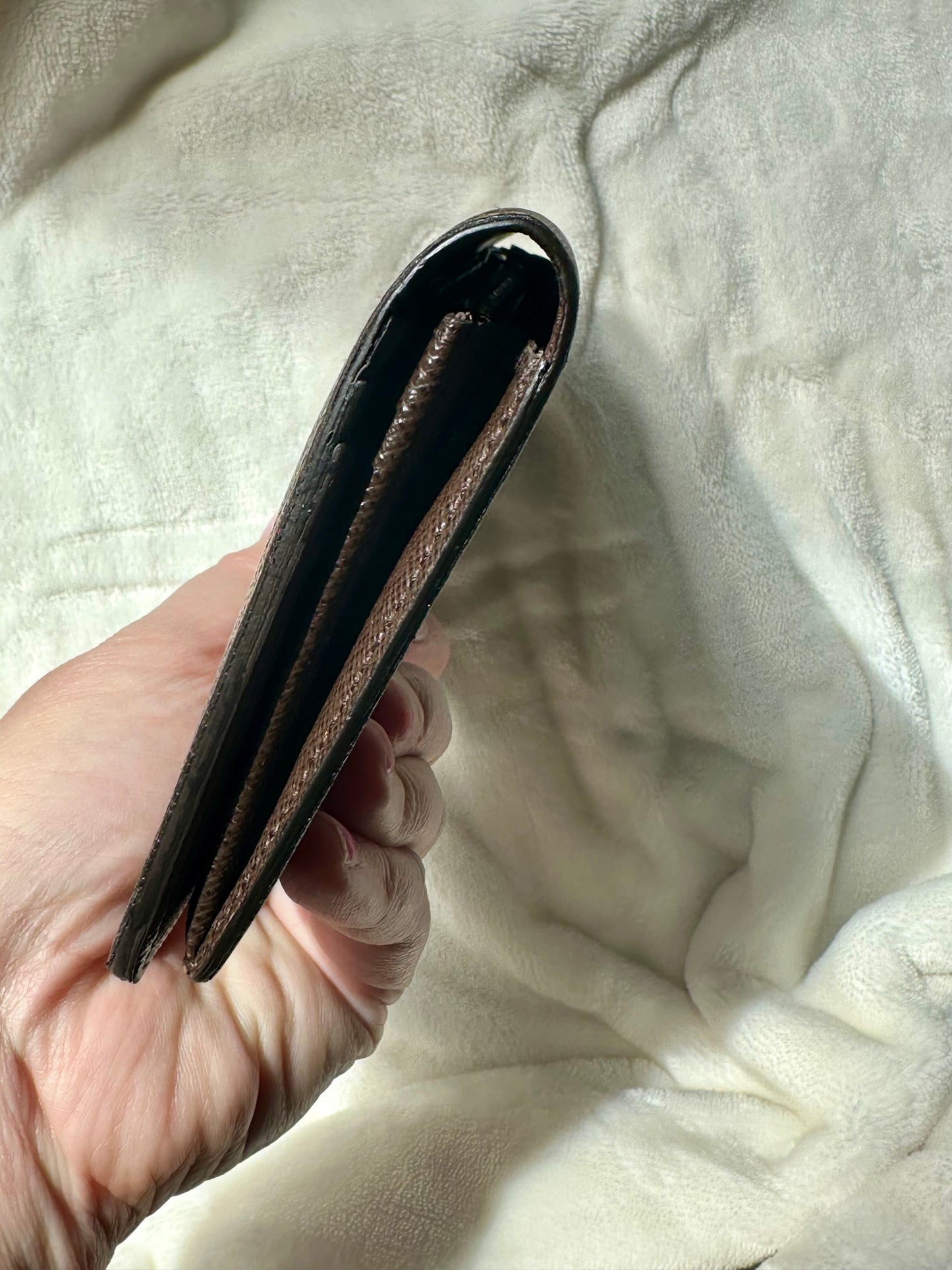 Louis Vuitton vertical bi-fold long wallet in Damier Ebene coated canvas