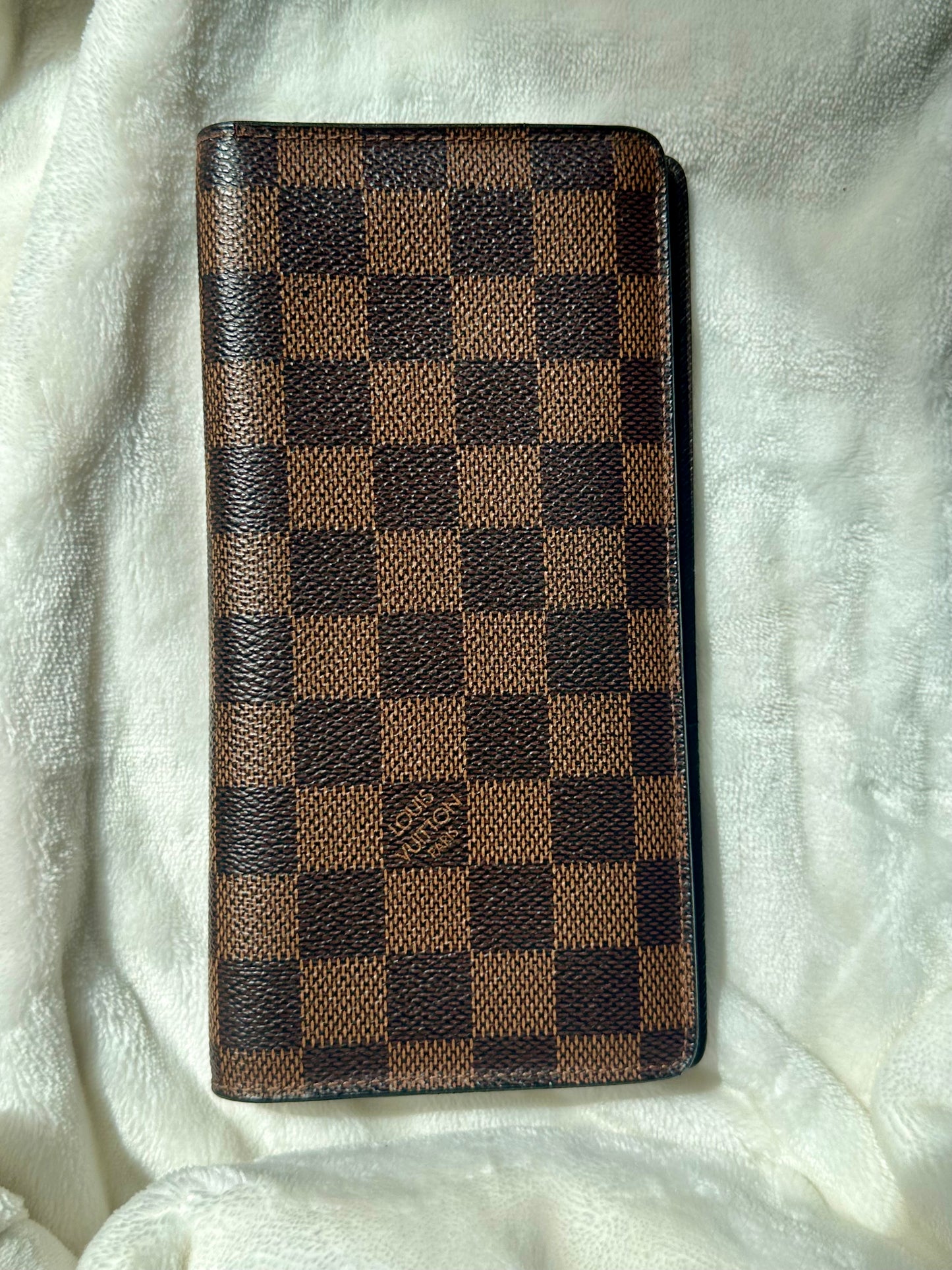 Louis Vuitton vertical bi-fold long wallet in Damier Ebene coated canvas