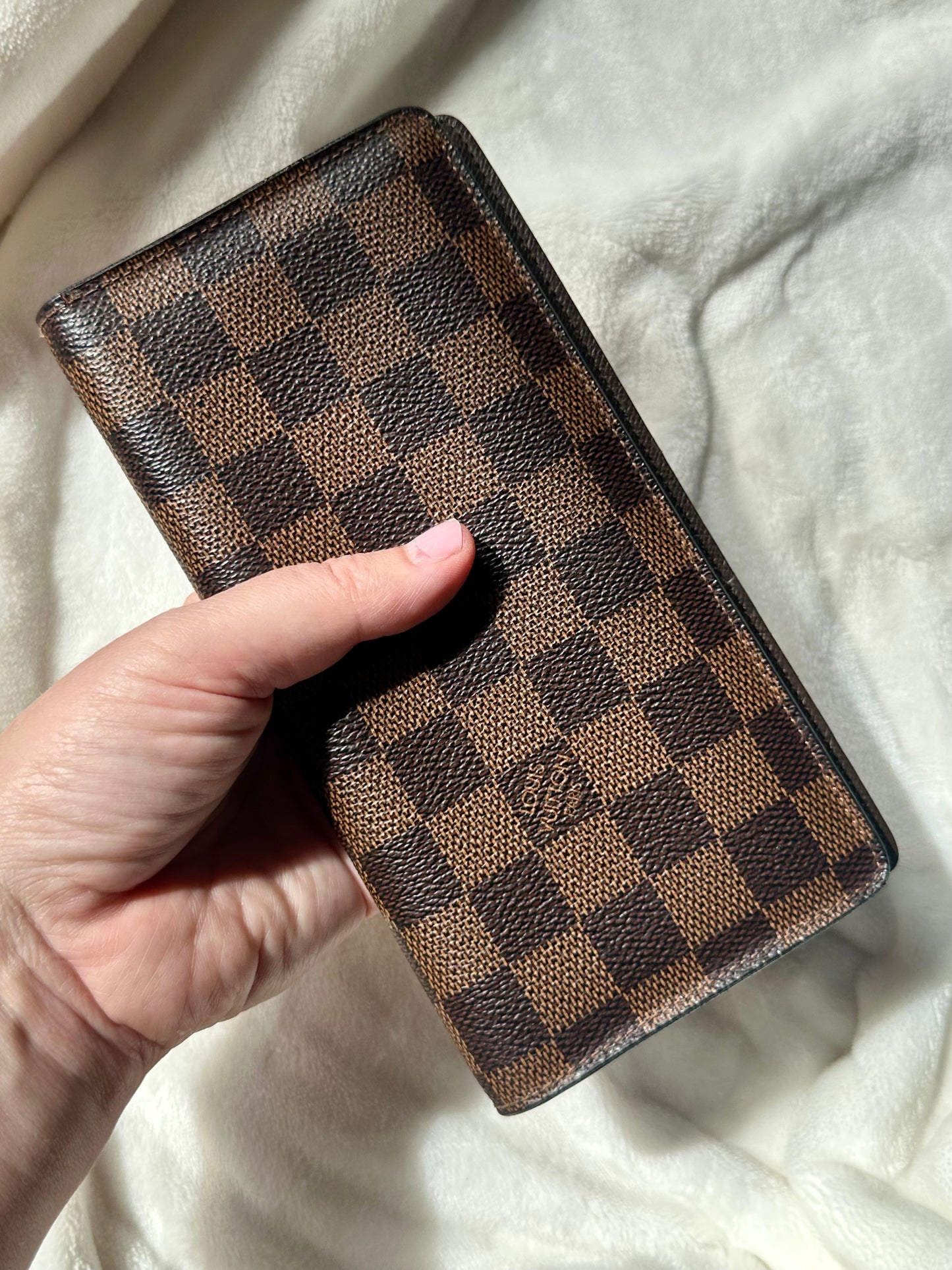 Louis Vuitton vertical bi-fold long wallet in Damier Ebene coated canvas