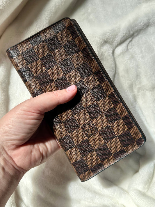 Louis Vuitton vertical bi-fold long wallet in Damier Ebene coated canvas